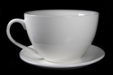 White porcelain cup on black background