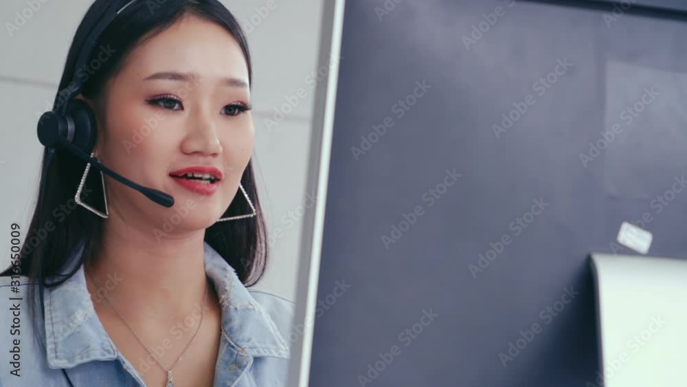 Aufkleber customer support agent or call center with headset works on desktop computer while supporting the cu