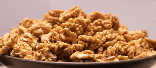 Walnut kernels in plate close up 