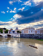 A view along the Tiber River towards St. Peter's Basilica and the Vatican in Rome, Italy.
