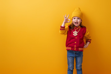Kid on bright color background.