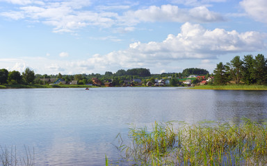Village Landscape With Lake On A Sunny Day