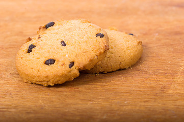 Chocolate cookies on wooden table. Chocolate chip cookies