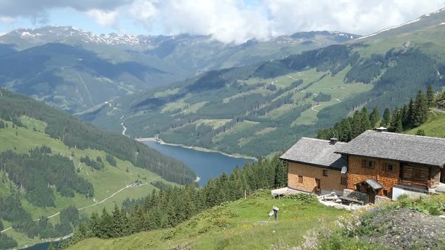Farmhouse hight in the High Taunern Mountain range with lake Durlassboden in Gerlostal valley Austria. Durlassboden Lake.