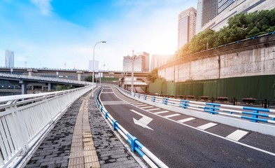 Urban road, bridge and urban building skyline..