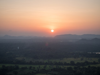 Sunset over the highland plains of sigiriya sri lanka
