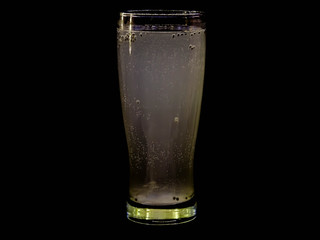 Fresh and cold drink isolated on black background
