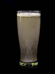 Fresh and cold drink isolated on black background