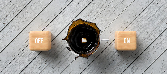 cup of coffee and cubes with text ON and OFF on wooden background