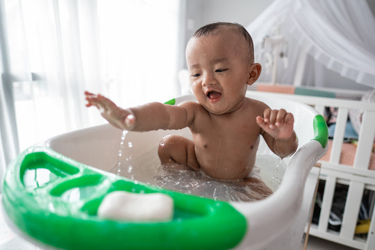 Happy Asian Boy Toddler Enjoy Play With Water While Taking A Bath