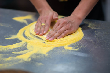 Worker making pizza in the restuarant