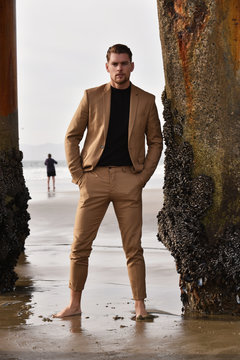 Sexy stylish man on the beach