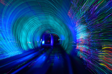 Automated cab car with streaking lights in the Bund Sightseeing Tunnel under the Huangpu River...