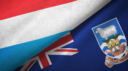 Fototapeta premium Luxembourg and Falkland Islands two flags textile cloth, fabric texture
