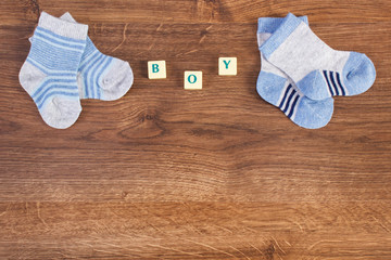 Obraz na płótnie Canvas Socks for baby and word boy, extending family concept