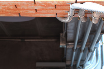 Electrical wiring work in a steel pipe of a house with a loft style decoration design.