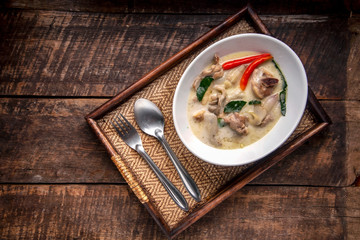 Chicken Coconut Soup (Tom Kha Gai),Coconut milk soup with chicken and Thai ingredients on the table, top view, Thai food that is popular in Thailand.