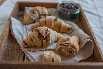 home made croissant filled with chocolate on a plate
