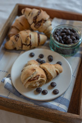 home made croissant filled with chocolate on a plate