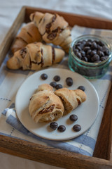 home made croissant filled with chocolate on a plate
