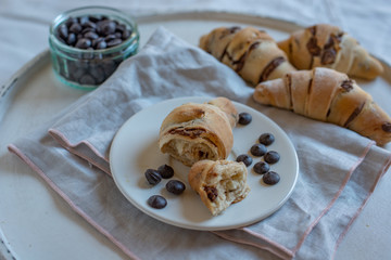home made croissant filled with chocolate on a plate