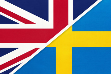 United Kingdom vs Sweden national flag from textile. Relationship between two european countries.