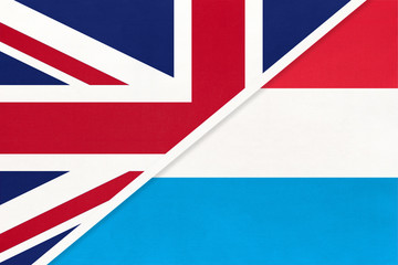 United Kingdom vs Luxembourg national flag from textile. Relationship between two european countries.