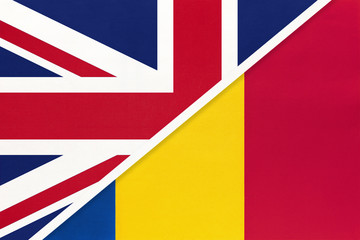 United Kingdom vs Romania national flag from textile. Relationship between two european countries.