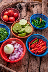 Raw materials in salad,Top view of raw materials such as   onion, lemon in container of kitchen ingredient for cooking food.