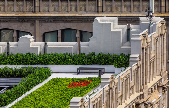 Bird's Eye Aerial View Of A Rooftop Garden On An Ornate Roof Of A Skyscraper In Midtown Manhattan New York