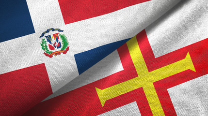 Dominican Republic and Guernsey two flags textile cloth, fabric texture