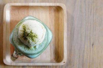Top view of Macha green tea shake topped with Vanilla Icecream