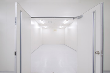 Perspective of empty warehouse store room with door open