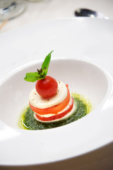 Tomatoes and Mozzarella Cheese with green sauce
