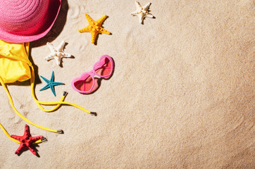 Fototapeta na wymiar Background with sandy beach, top view. Summer accessories concept