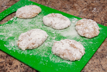 Cutlets on a green board in the kitchen