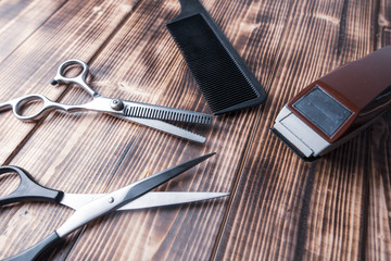 Scissors and combs and a clipper