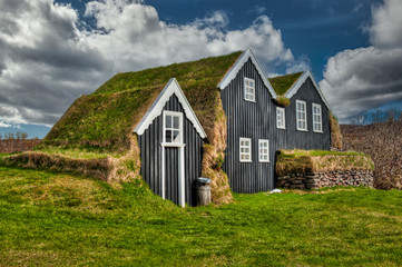 Typical view of turf-top houses in Icelandic countryside.