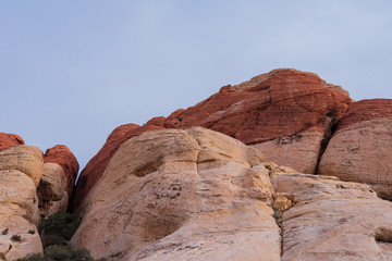 Low angle landscape of massive white and red rock formations at Red Rock Canyon Conservation Area in Las Vegas, Nevada