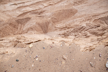 Dangerous edge of the sand quarry and steep cliff down. Quarrying and mining of building material.
