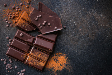 chocolate (delicious cocoa dessert, pieces of sweets) menu concept. food background. top view. copy...