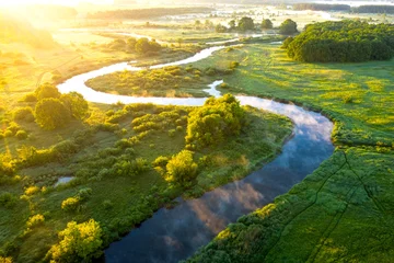 Abwaschbare Fototapete Morgen mit Nebel Aerial view of beautiful landscape of foggy river and green fields. Sunrise over river in summer