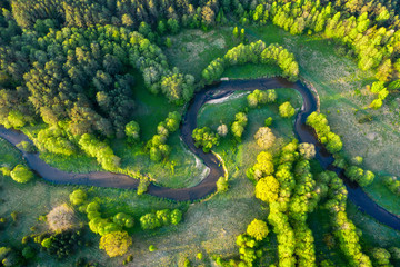 Beautiful scenery of winding river, aerial view. Sunrise in summer day