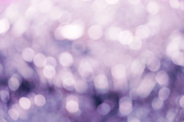 Blurred lights of purple bokeh abstract color background