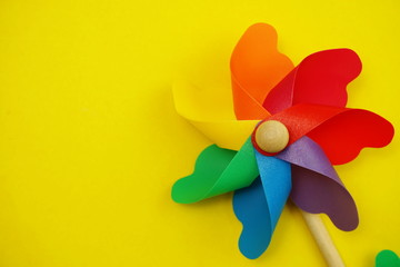 colorful pinwheel with space copy isolated on yellow background