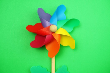 colorful pinwheel with space copy isolated on green background