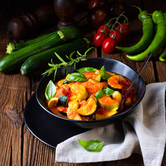 zucchini vegetarian ratatouille with tomato sauce and herbs