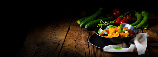 zucchini vegetarian ratatouille with tomato sauce and herbs