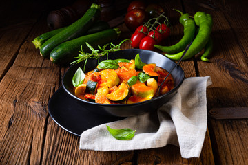 zucchini vegetarian ratatouille with tomato sauce and herbs
