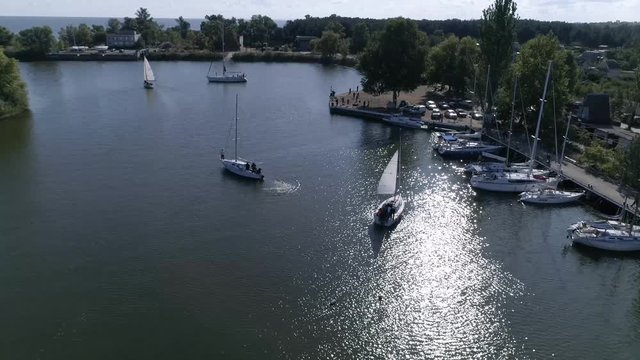 Aerial top view of a sailing yacht regatta. Flying over boats. 4k video